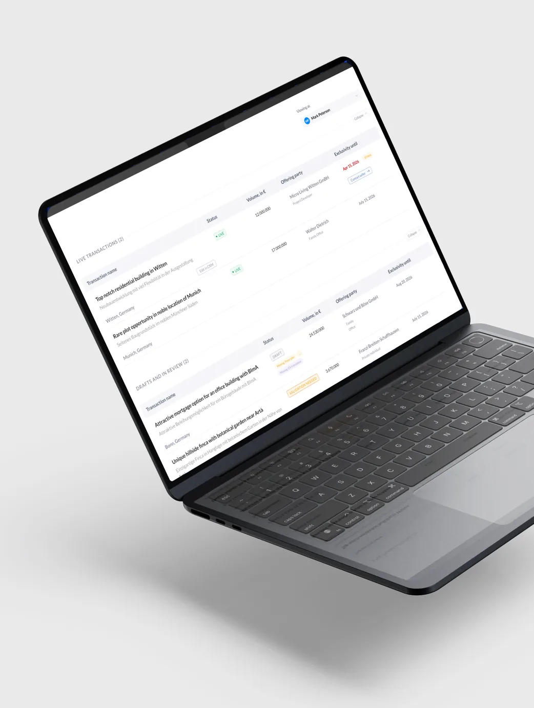 A dashboard of listings open on a MacBook, seen at an angle