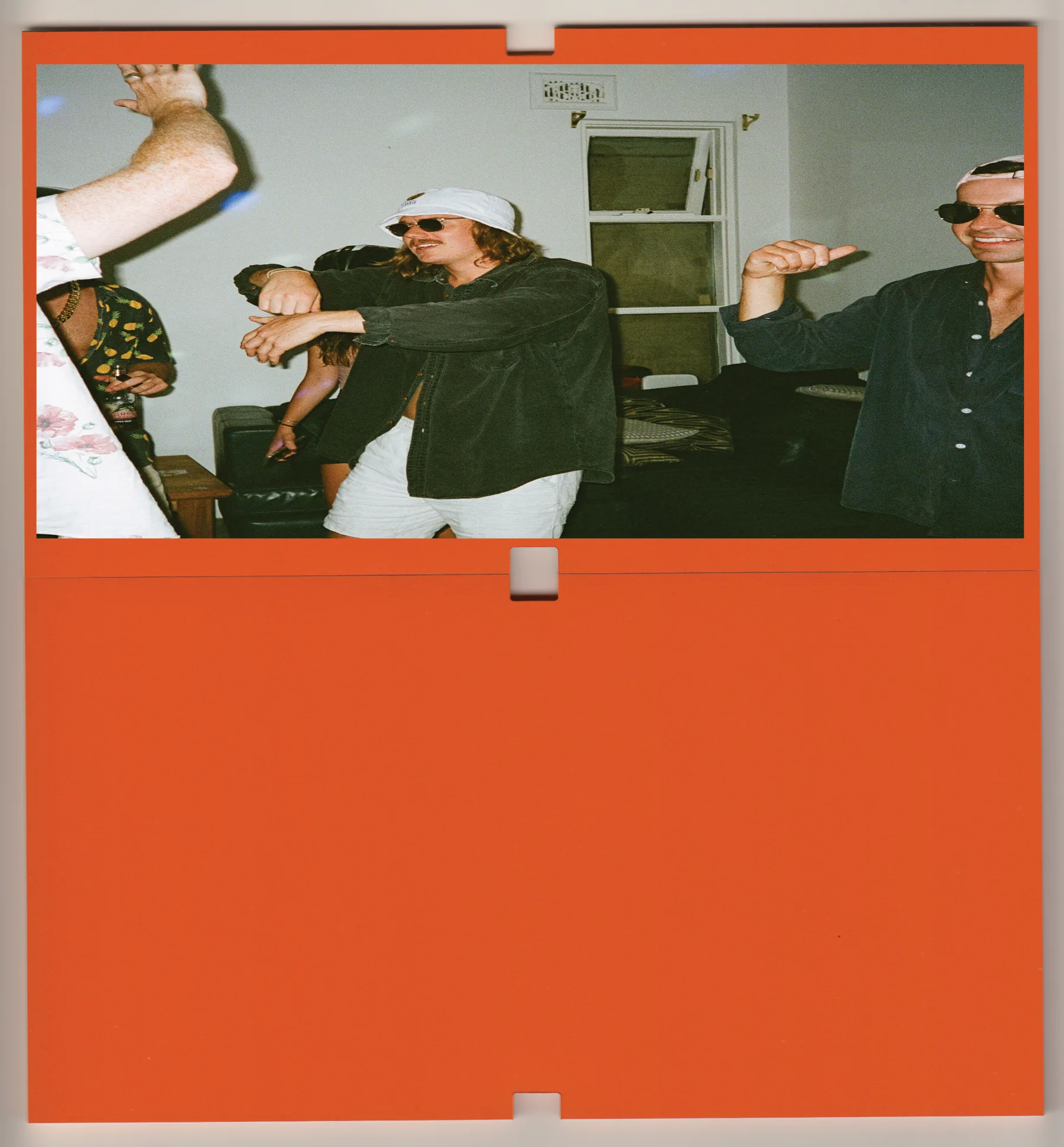 Mudee poster: a photograph above the wordmark on an orange field